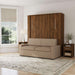 Modern Walnut Inovabed Wall Bed with Sofa and Two Nightstands closed as a beige sofa in a bright room with a nightstand alongside, a roman shade and a floor lamp