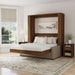 Modern Walnut Inovabed Wall Bed with Sofa and Two Nightstands opened in a bright room between two nightstands, with white bedding and a framed landscape print above the headboard