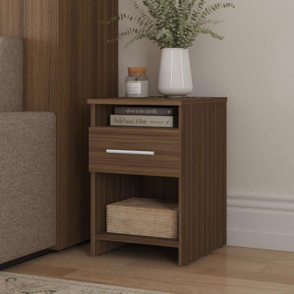 Modern Walnut Inovabed Wall Bed with Sofa and Two Nightstands showing one nightstand beside the sofa, styled with a vase of greenery, a candle, books in the open cubby and a woven basket below