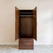 Modern Walnut Inovabed Wall Bed with Sofa and Wide Flex Cabinet showing the Wide Flex Cabinet open head-on in a room, with a wardrobe rod and a shelf above it