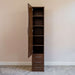 Modern Walnut Inovabed Wall Bed with Table and Two Narrow Flex Cabinets showing one Narrow Flex Cabinet with its door open on empty shelves above three closed drawers