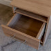 Natural Oak Inovabed Wall Bed with Sofa and Two Nightstands in close-up with a nightstand drawer pulled open, showing the empty interior and full-extension slide