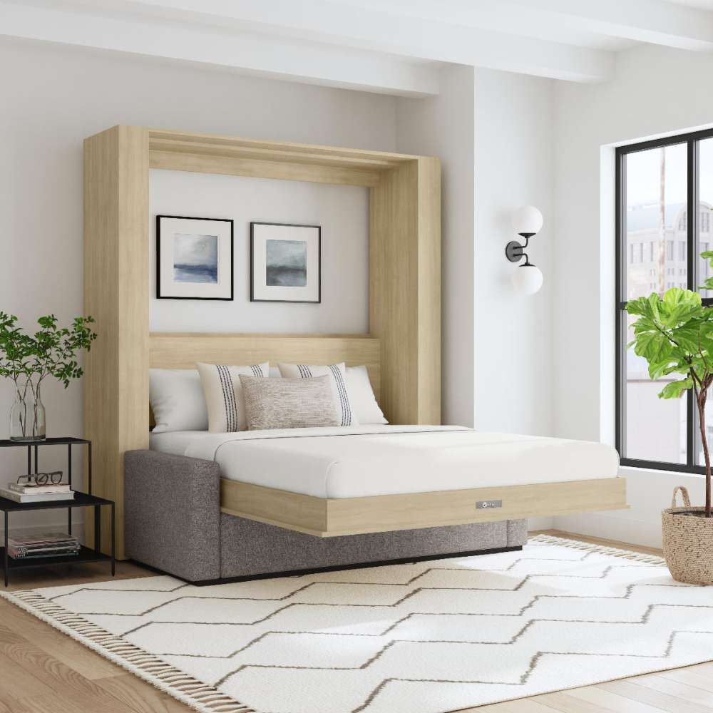 Natural Oak Inovabed Wall Bed with Sofa and Two Nightstands opened in a loft-style room with white bedding, two framed prints above the headboard and a gray sofa base