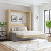 Natural Oak Inovabed Wall Bed with Sofa and Two Nightstands opened in a loft-style room with white bedding, two framed prints above the headboard and a gray sofa base