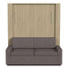 Natural Oak Inovabed Wall Bed with Sofa and Two Nightstands seen head-on on a white background, closed with a two-seat gray sofa in front of the cabinet