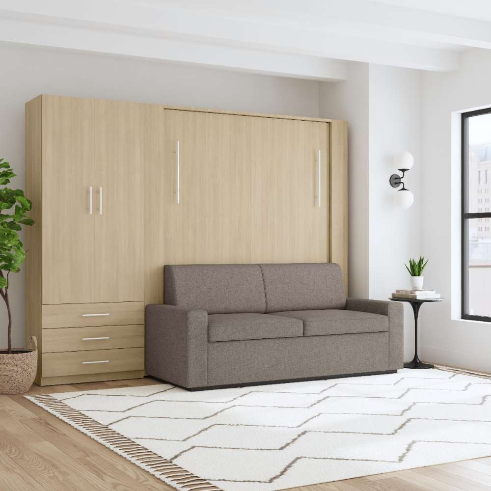 Natural Oak Inovabed Wall Bed with Sofa and Wide Flex Cabinet closed as a gray sofa in a bright room beside the Wide Flex Cabinet, with a round side table alongside