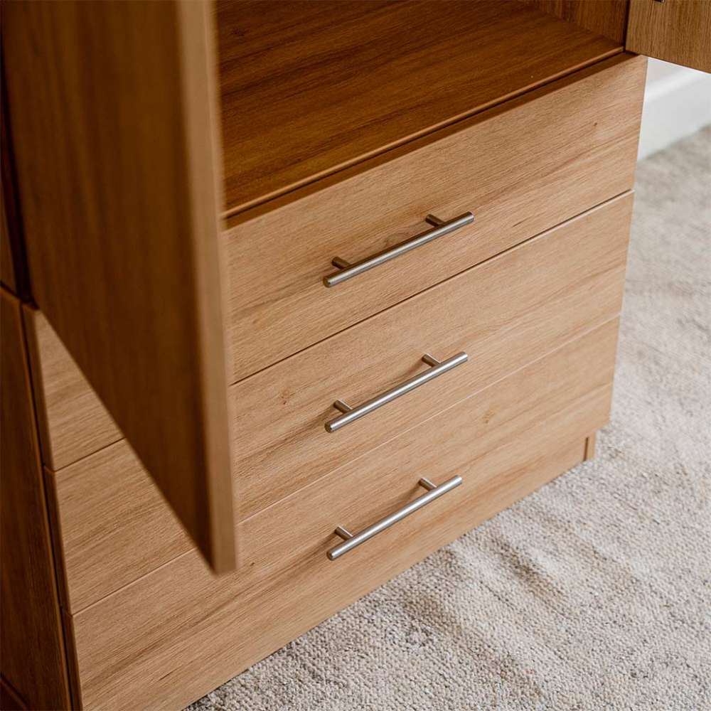 Natural Oak Inovabed Wall Bed with Sofa and Wide Flex Cabinet in close-up on the three Wide Flex Cabinet drawer fronts with one door ajar beside them
