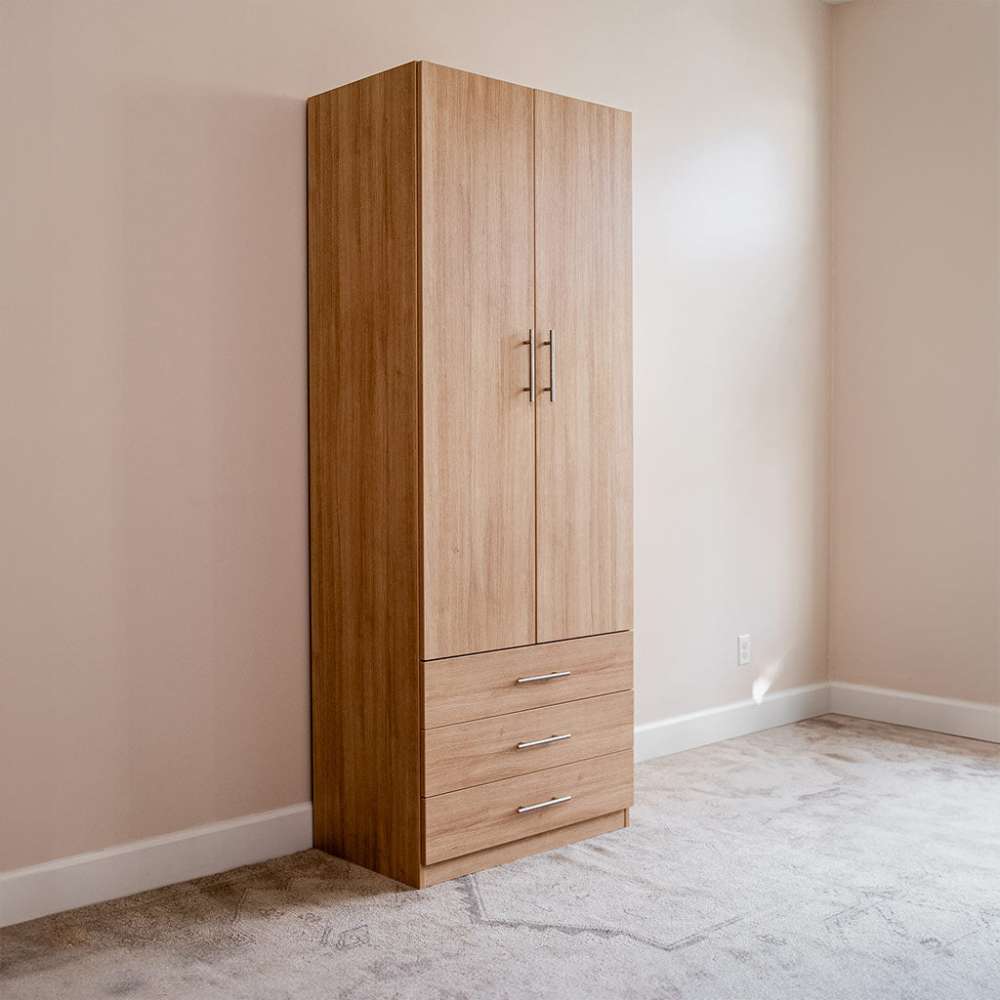 Natural Oak Inovabed Wall Bed with Sofa and Wide Flex Cabinet showing the Wide Flex Cabinet closed at an angle in the corner of an empty room