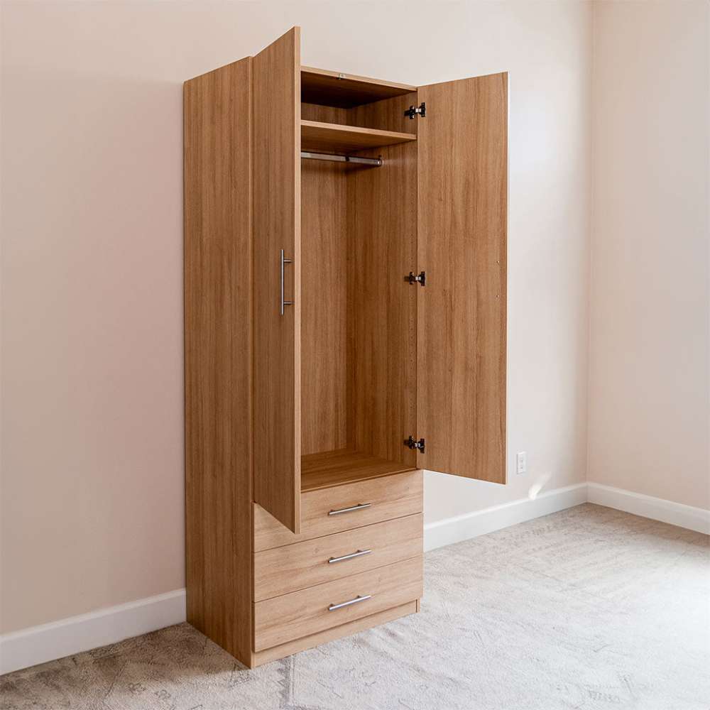 Natural Oak Inovabed Wall Bed with Sofa and Wide Flex Cabinet showing the Wide Flex Cabinet open at an angle in a room, with an empty wardrobe rod and three drawers below