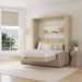 Natural Oak Inovabed Wall Bed with Sofa opened in a bright room with white bedding, a framed landscape print above the headboard and a woven side table beside it