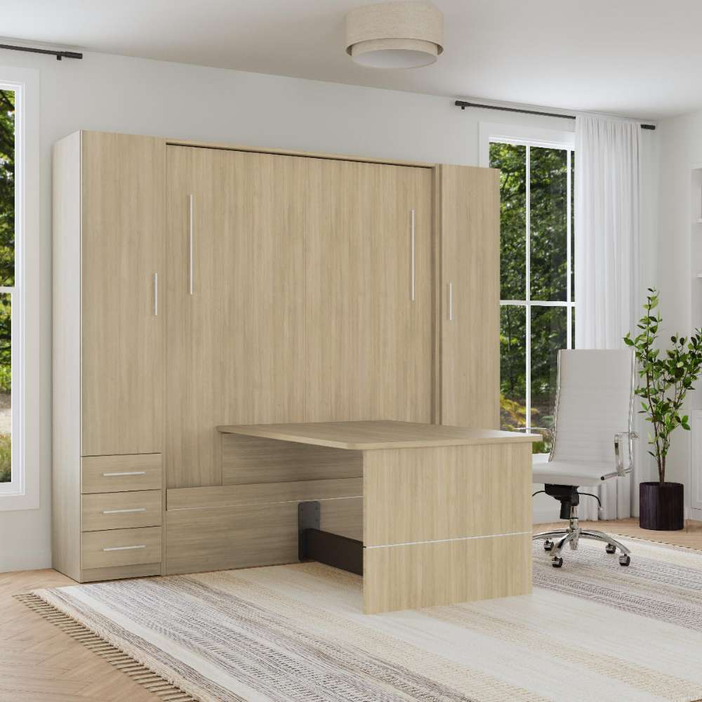 Natural Oak Inovabed Wall Bed with Table and Two Narrow Flex Cabinets closed in a bright room with the table extended and a white office chair pulled up to it