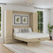 Natural Oak Inovabed Wall Bed with Table and Two Narrow Flex Cabinets opened in a bright room between the two cabinets, with white bedding and two framed botanical prints above the headboard