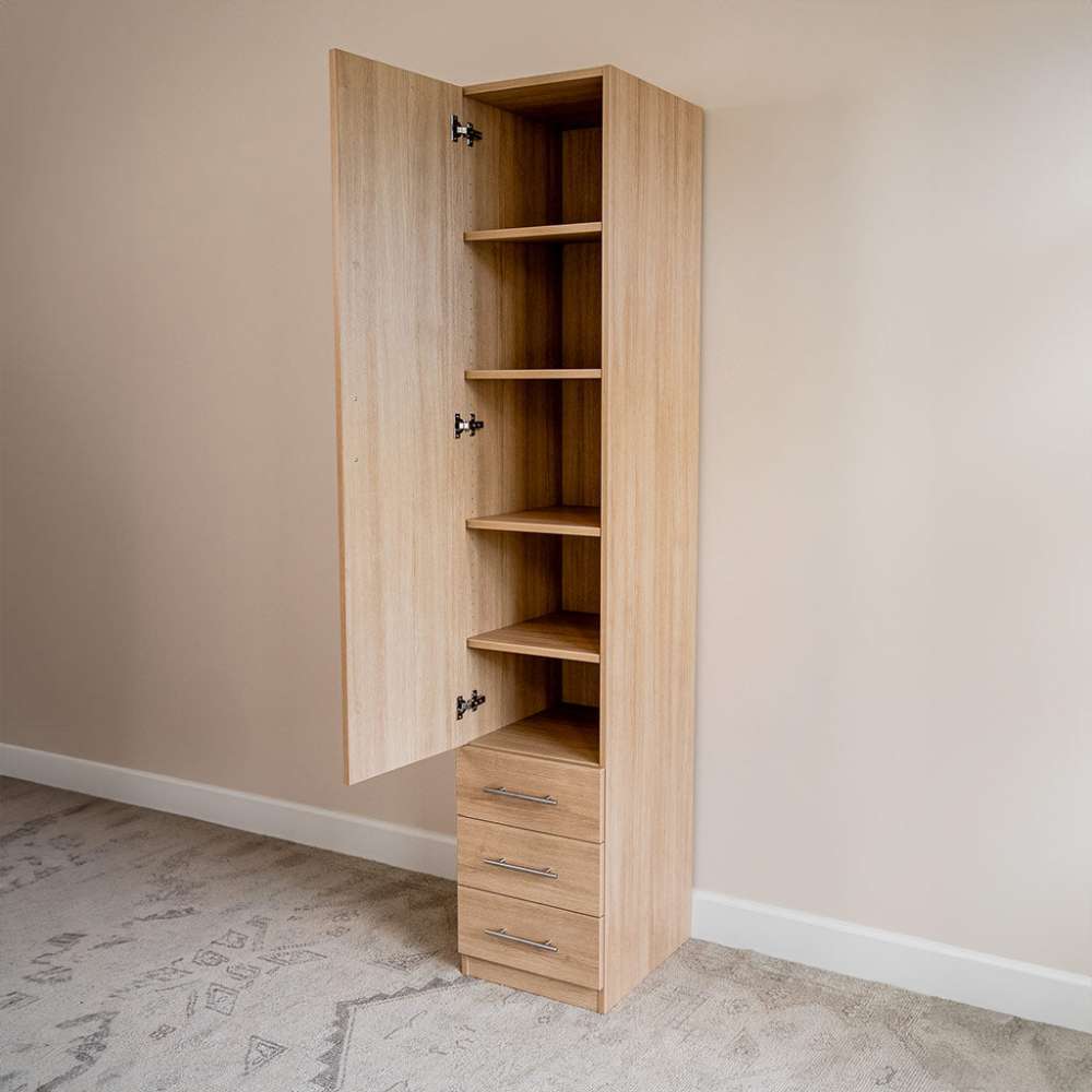 Natural Oak Inovabed Wall Bed with Table and Two Narrow Flex Cabinets showing one Narrow Flex Cabinet with its door open on empty shelves above three closed drawers