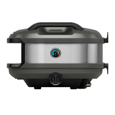 Off-Black Gozney Tread Pizza Oven side profile on white showing the brushed stainless side panel with its round temperature gauge and the gas fitting below.