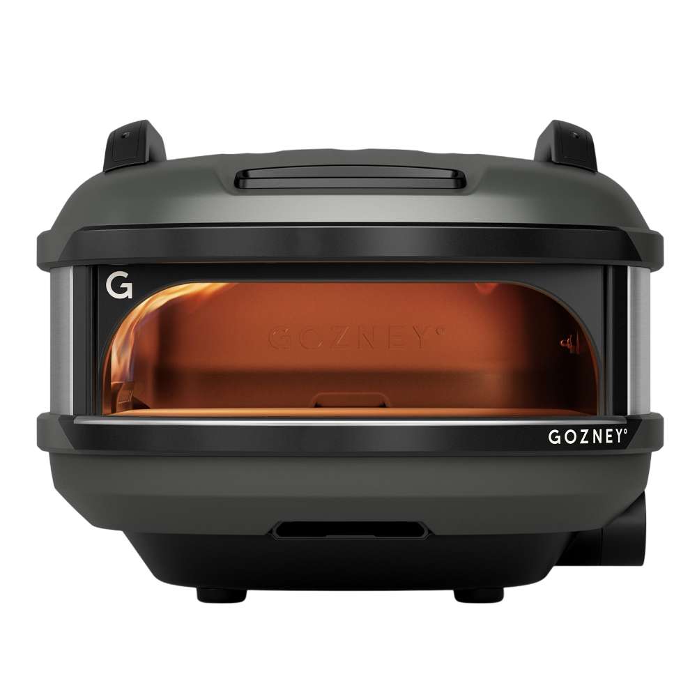 Off-Black Gozney Tread Pizza Oven straight-on front view on white with the wide arched mouth the copper-toned dome and the carry handles on top.