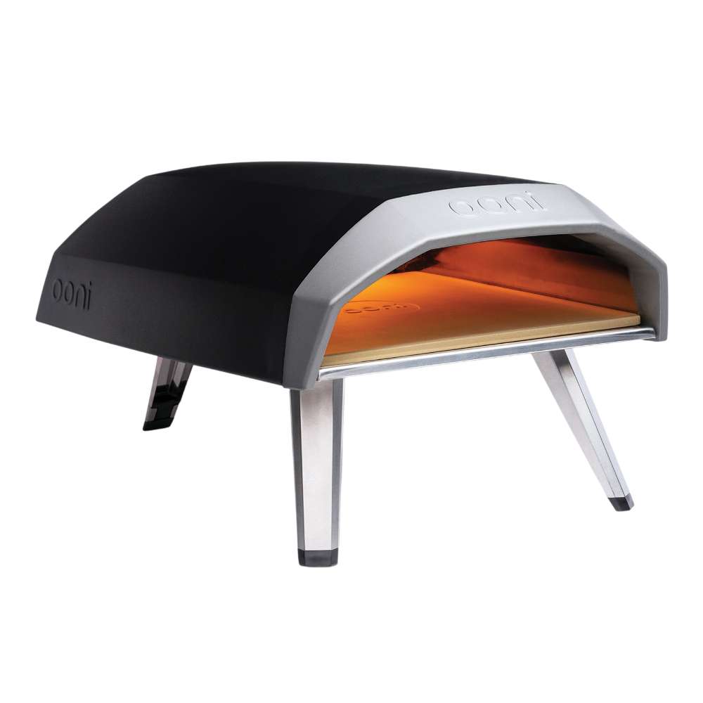 Ooni Koda 12 Outdoor Pizza Oven angled left view of the black shell with the glowing orange interior and the ooni logo on the side.