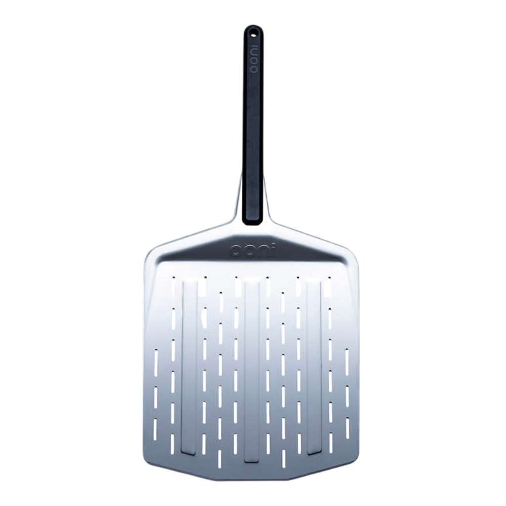 Ooni Koda 2 Pizza Oven and 12" Pizza Peel standing upright showing the perforated stainless blade and the long black handle.