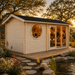 Sauna Sanna 90 at golden hour with four guests relaxing inside beside a landscaped pond and native Texas garden.