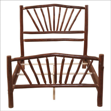 traight-on view of the fully assembled Fireside Lodge Hickory Log Sunburst Bed frame without a mattress showing the sunburst log pattern on both headboard and footboard