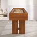 Walnut Crate & Barrel Shuffleboard seen end on in a room with white panelled walls and grey tile floors, looking down the pale maple playfield to pucks at the far end