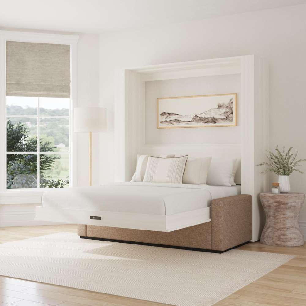 White Ash Inovabed Wall Bed with Sofa and Two Nightstands opened in a bright room with white bedding, a framed landscape print above the headboard and a woven side table alongside