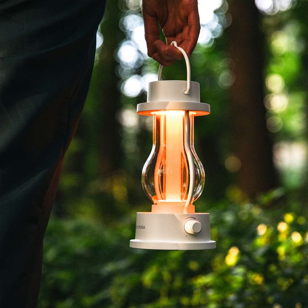 White Crate & Barrel Balmuda LED Rechargeable Outdoor Lantern shown on a plain background, a compact lantern for outdoor tables or an indoor nightlight