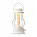 White Crate & Barrel Balmuda LED Rechargeable Outdoor Lantern with a white body, metal carry handle and a central tube that guides the light downward