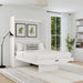 White Inovabed Murphy Bed with Desk opened in a bright bedroom with white bedding, a striped lumbar pillow and two framed botanical prints above the headboard