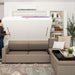 White Inovabed Wall Bed with Extended Sofa photograph of a person pulling the bed down from the closed sofa position
