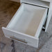 White Inovabed Wall Bed with Sofa and Two Nightstands in close-up with a nightstand drawer pulled open and empty