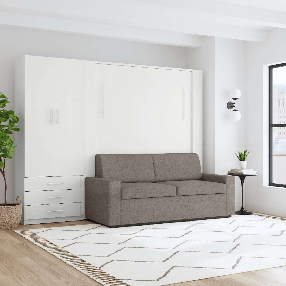 White Inovabed Wall Bed with Sofa and Wide Flex Cabinet closed as a gray sofa in a loft-style room with a wall sconce, a round side table and a tall window