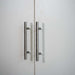 White Inovabed Wall Bed with Sofa and Wide Flex Cabinet in close-up on the two Wide Flex Cabinet door fronts and their slim bar pull handles