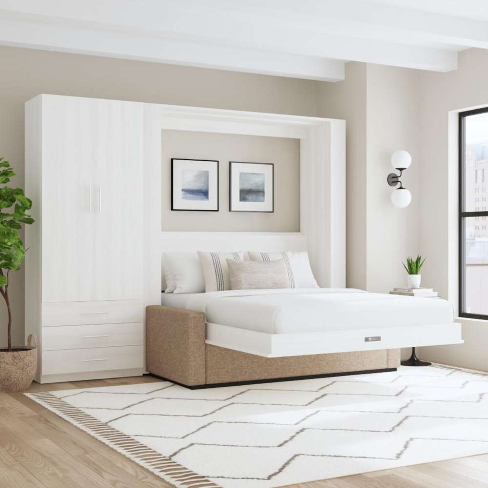 White Inovabed Wall Bed with Sofa and Wide Flex Cabinet opened in a bright room beside the Wide Flex Cabinet, with white bedding, a beige sofa base and two framed prints above the headboard