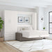 White Inovabed Wall Bed with Sofa and Wide Flex Cabinet opened in a bright room beside the Wide Flex Cabinet, with white bedding, a gray sofa base and two framed prints above the headboard