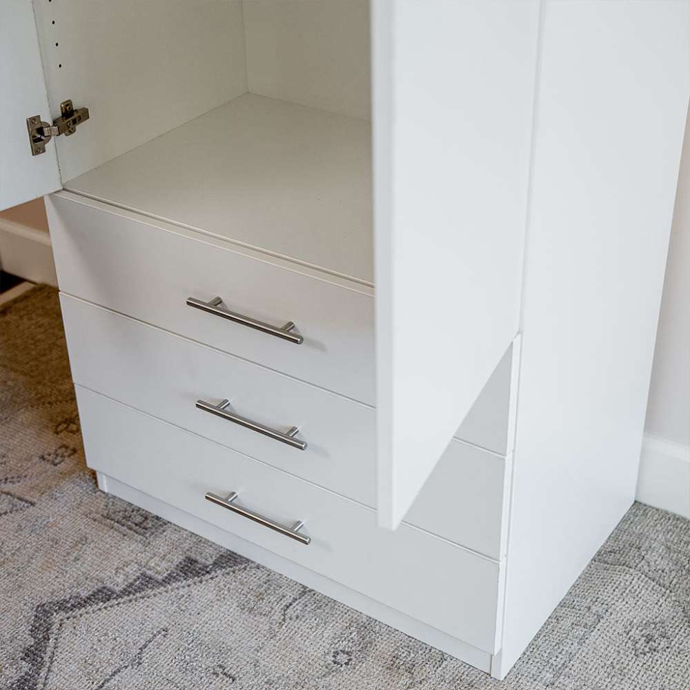 White Inovabed Wall Bed with Sofa and Wide Flex Cabinet showing the lower half of the Wide Flex Cabinet with one door open beside the three drawers