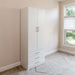 White Inovabed Wall Bed with Sofa and Wide Flex Cabinet showing the Wide Flex Cabinet closed beside a window in a carpeted room