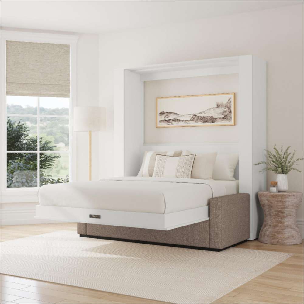 White Inovabed Wall Bed with Sofa opened in a bright room with white bedding, a framed landscape print above the headboard and a woven side table beside it