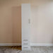 White Inovabed Wall Bed with Table and Two Narrow Flex Cabinets showing one Narrow Flex Cabinet closed against a wall, with a tall door above three drawers