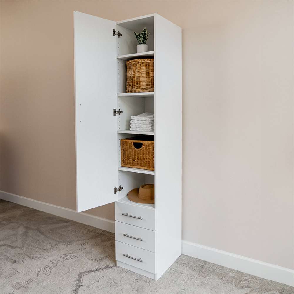 White Inovabed Wall Bed with Table and Two Narrow Flex Cabinets showing one Narrow Flex Cabinet open and styled with woven baskets, folded towels, a hat and a small plant