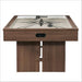Woodgrain Crate & Barrel Air Hockey Table seen straight from the end on a white background with the oval goal opening in the cabinet, the starburst field above and two slab legs joined by a low stretcher