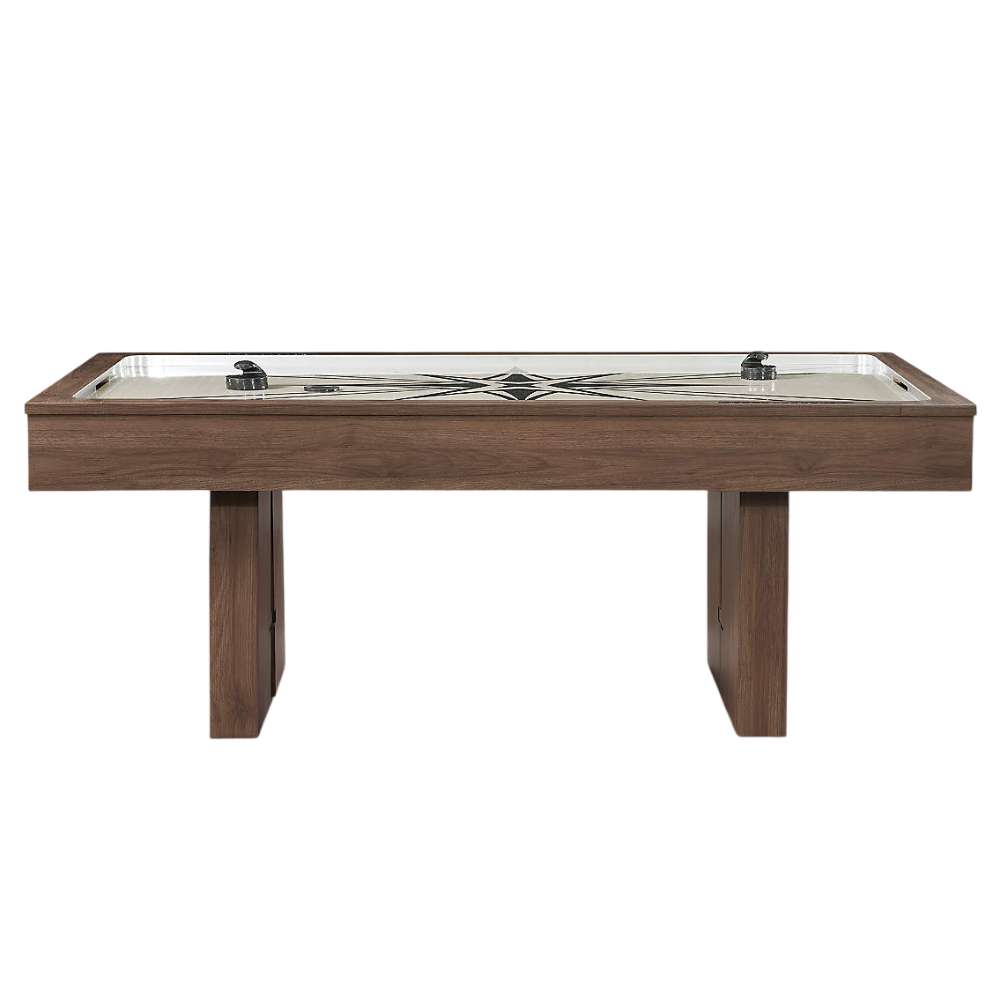Woodgrain Crate & Barrel Air Hockey Table seen straight from the side on a white background showing the full length of the cabinet, the cream field with two black strikers and two angled slab legs