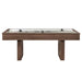 Woodgrain Crate & Barrel Air Hockey Table seen straight from the side on a white background showing the full length of the cabinet, the cream field with two black strikers and two angled slab legs